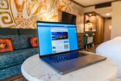 An open laptop on a table in a room at Disney’s Polynesian Village Resort