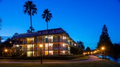 Disney’s Port Orleans Resort French Quarter, a 3 story building surrounded by a walkway and adjacent to the Sassagoula River