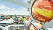 Guests riding Astro Orbiter at Magic Kingdom Guests riding Astro Orbiter at Magic Kingdom