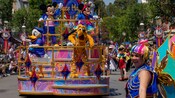 Mickey Mouse, Minnie Mouse, Donald Duck and Pluto on a float in the Celebrate Happy Cavalcade