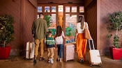 At the Disneyland Resort, a family arrives with their luggage at Disneys Grand Californian Hotel and Spa.