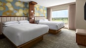 A Family Suite at Anaheim Marriott Suites featuring a bedroom with 2 queen beds and a large window