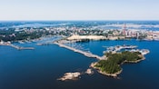 The 2 islands of Kotka, Finland with patches of woodlands and city buildings