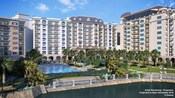 An outdoor pool area overlooking a lake at Disney’s Riviera Resort