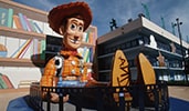 A giant statue of Woody from Toy Story sits next to Disney's All Star Resorts