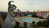 A giant statue of Tramp the dog overlooks the swimming pool at Disney's Pop Century Resort