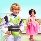A young boy wearing a Buzz Lightyear costume and a young girl wearing a Princess Aurora costume