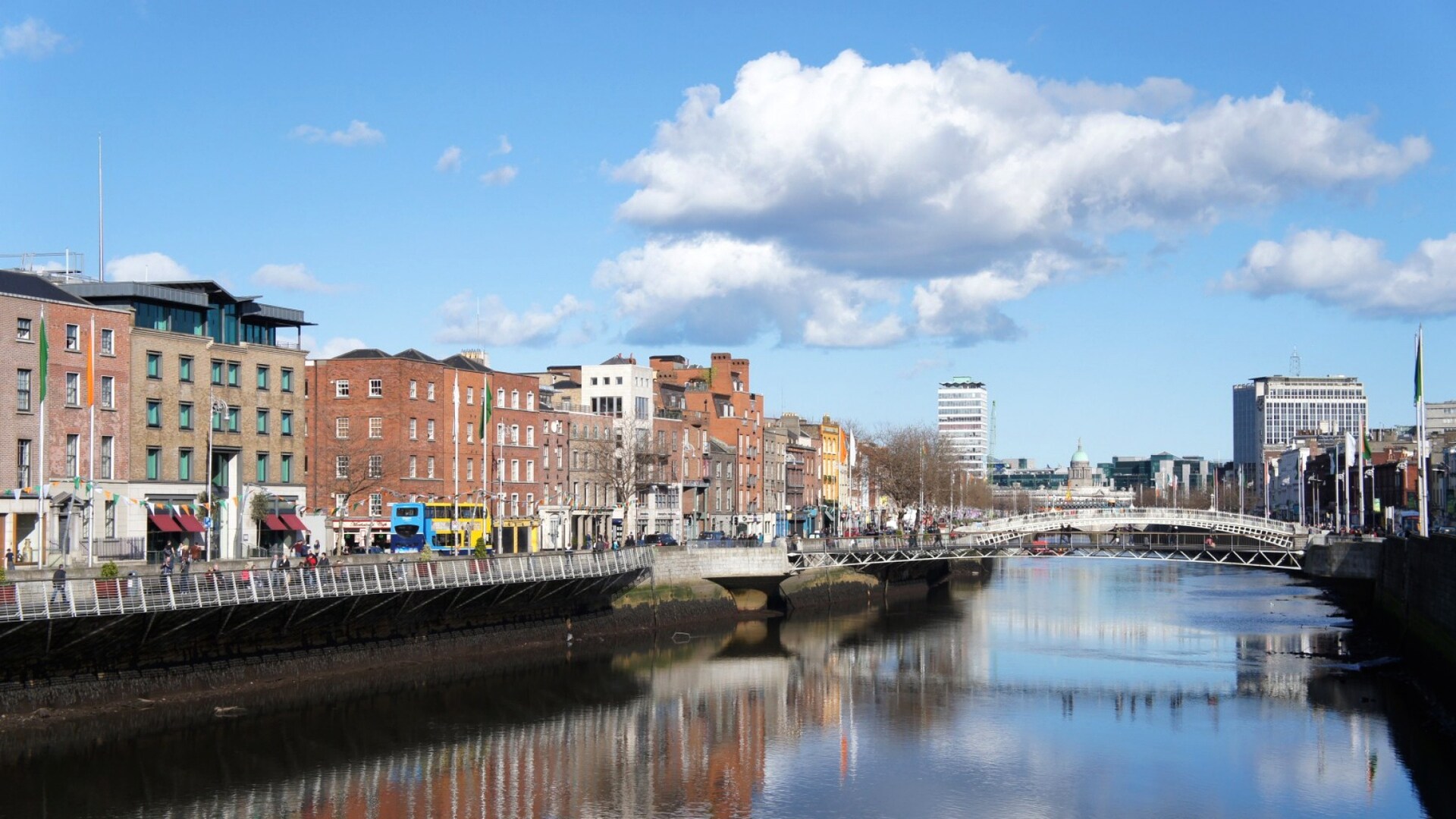 Four- and five-story brick apartment buildings lining the banks of River Liffey