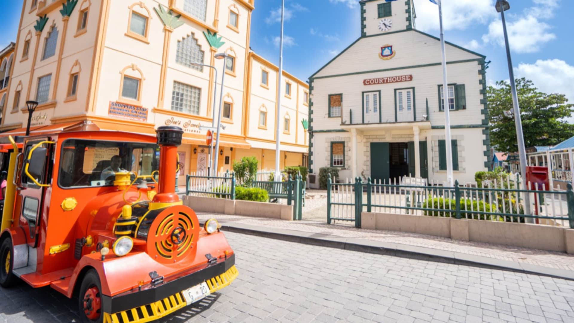 A trolley driving by the historic Phillipsburg Courthouse