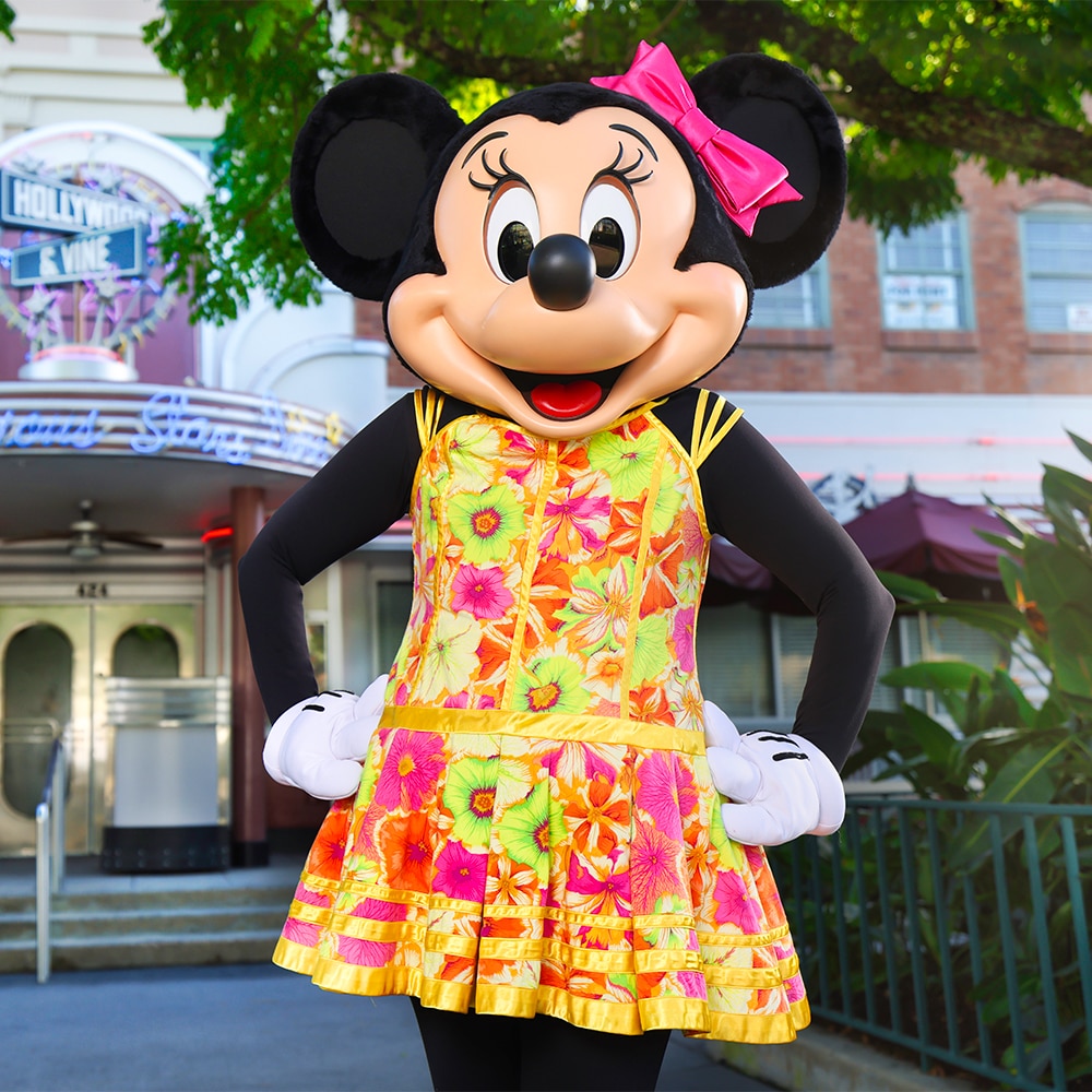 Minnie Mouse strikes a pose in front of Hollywood and Vine wearing a strappy summer dress