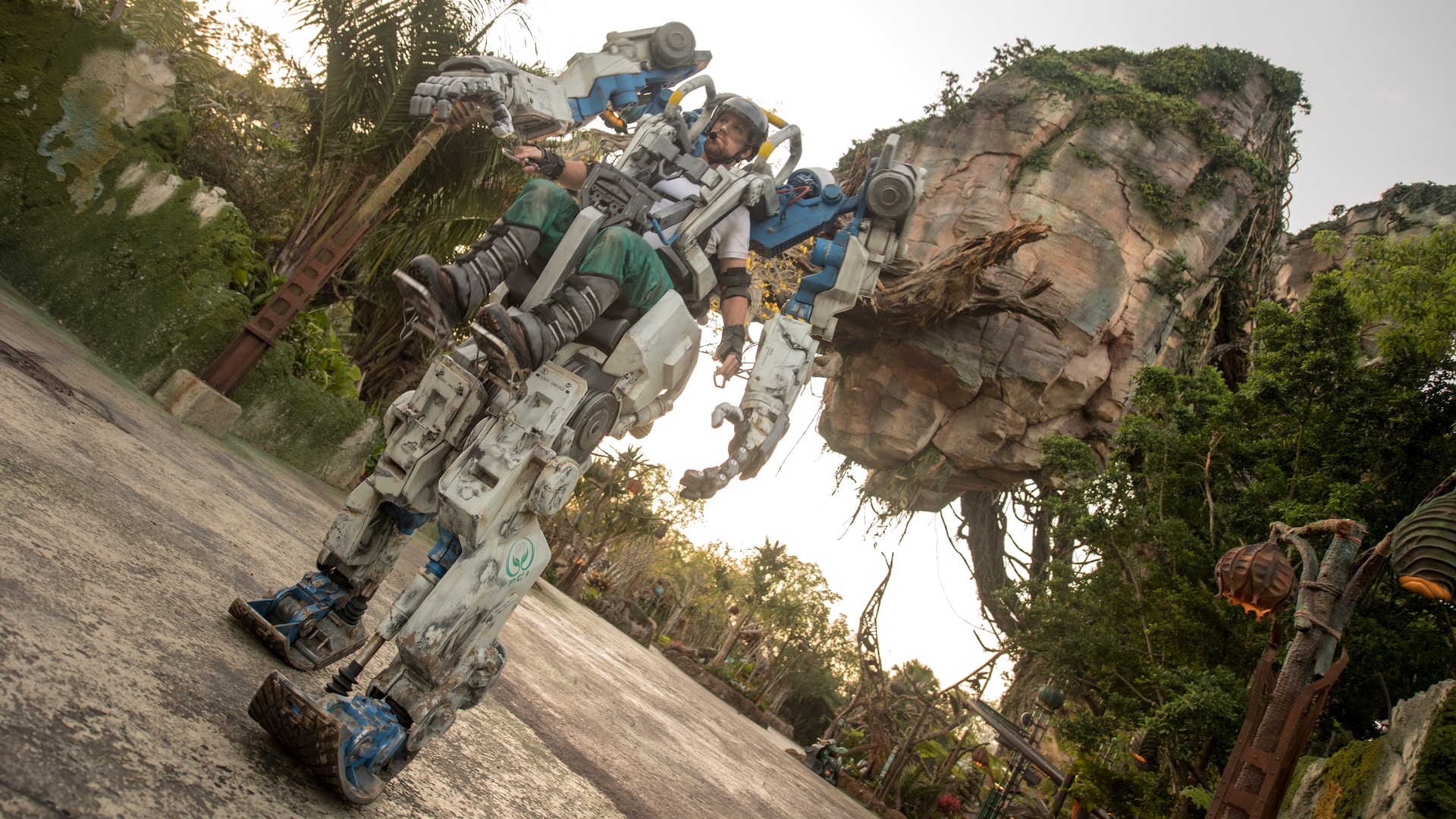 A pilot maneuvers a ten foot high Pandora Utility Suit within Pandora The World of Avatar