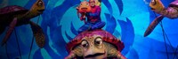 Marlin and Nemo riding atop Crush the turtle during a live    performance of Finding Nemo, The Big Blue and Beyond  