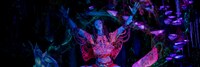 The Shaman of Songs glowing amid a bioluminescent forest in Na'vi River Journey