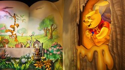 A storybook illustration of a party for Pooh at The Many Adventures of Winnie the Pooh