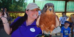 Adventure Guide Jennae poses with a bird Adventure Guide Jennae poses with a bird