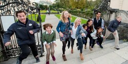 Guests and their Adventure Guides run up a set of stairs on a visit to a historic site Guests and their Adventure Guides run up a set of stairs on a visit to a historic site