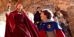 A mother and son get dressed up in historic costumes as they explore a castle A mother and son get dressed up in historic costumes as they explore a castle