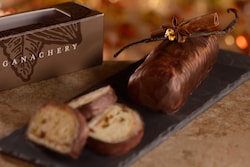 A chocolate dessert beside a box that reads 'Ganachery' 