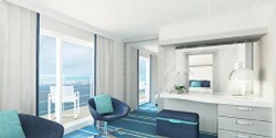A grand privilege suite, featuring chairs, a desk, and a balcony A grand privilege suite, featuring chairs, a desk, and a balcony