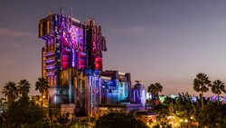 Guardians of the Galaxy, Monsters After Dark, a futuristic, dystopian skyscraper at night