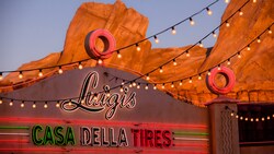 A neon sign identifies Luigi's Casa Della Tires