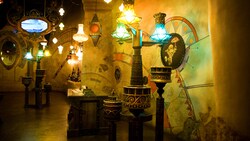 Many lamps hang from the Sorcerer's Workshop ceiling
