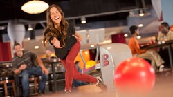 A woman bowling at Splitsville Luxury Lanes