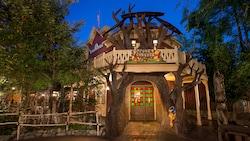 Tigger, Pooh, honey pots and other Hundred-Acre Wood-themed décor lining the entrance of Pooh Corner