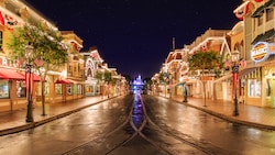 Vibrant lights line rooftops and marques at Main Street, U.S.A. on the way to Sleeping Beauty Castle