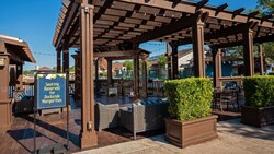 The outdoor dining space with couches and tables at Dockside Margaritas in Disney Springs
