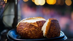 A tray with Soup in Sourdough Bread Bowl from Royal Street Veranda