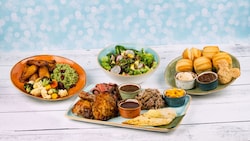 Four dishes from Sebastian's Bistro including Buttery House Baked Pull Apart Rolls, The Spice Necklace Salad, Entrée Sides and Taste of the Caribbean Entrée 