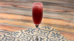 A pomegranate mimosa on a placemat