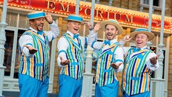 The Dapper Dans, a 4 man barbershop quartet, singing near the Emporium in Magic Kingdom park