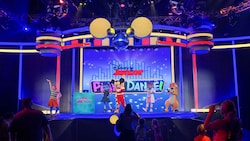 Mickey Mouse and friends with a sign that says 'Disney Junior Play and Dance' at Disney's Hollywood Studios theme park