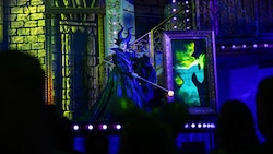 Maleficent on stage with an animated portrait of Aurora during Disney Villains, Unfairly Ever After at Disney’s Hollywood Studios