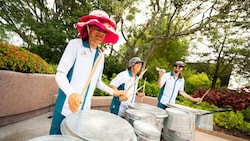 Percussion ensemble The Jammitors using stainless steel trash cans to perform music at Epcot
