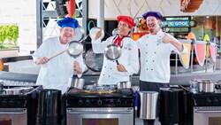 The Jammin’ Chefs holding pots and drumsticks