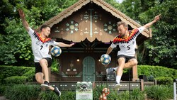 A soccer duo freestyling with soccer balls near the Germany Gazebo at Epcot