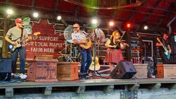 Members of the musical group Alex Richard’s Kitchen Party performing at the Canada Pavilion in EPCOT