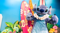 Stitch posing on a beach themed set