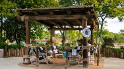 Beachcomber Shack 5, a shaded private cabana with lounge chairs at Disney's Typhoon Lagoon water park