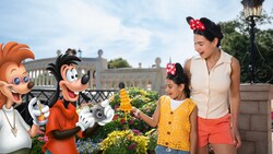 A Disney PhotoPass Magic Shot featuring 2 Guests holding the Leaning Tower of Cheeza from ‘A Goofy Movie’ while Max Goof and Bobby Zimmeruski take a picture of them in Epcot