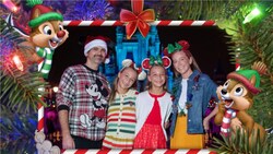 A Chip and Dale Magic Shot overlay over a family of 4 wearing Christmas apparel near Cinderella Castle