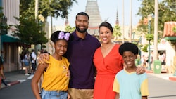 Two parents, their daughter and their son pose for a photo on Hollywood Boulevard