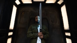 A man wielding the dark saber