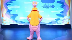 Figment posing on a stage 