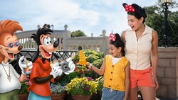 A Disney Magic Shot, featuring Max Goof and Bobby Zimmeruski from a Goofy Movie and a Leaning Tower of Cheeza, with a mom and her daughter