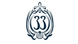 The Club 33 logo featuring the number 33 framed by ornate scrollwork, rendered as a line illustration