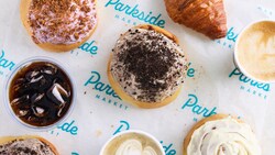 Four frosted donuts, 2 cappuccinos, a croissant and a drink from Sip & Sonder